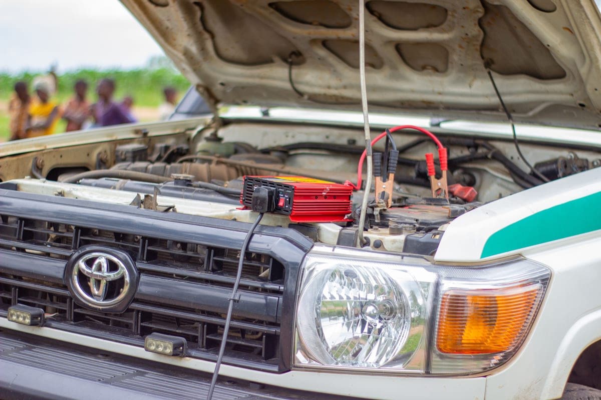 A smart battery charger connected to a car battery
