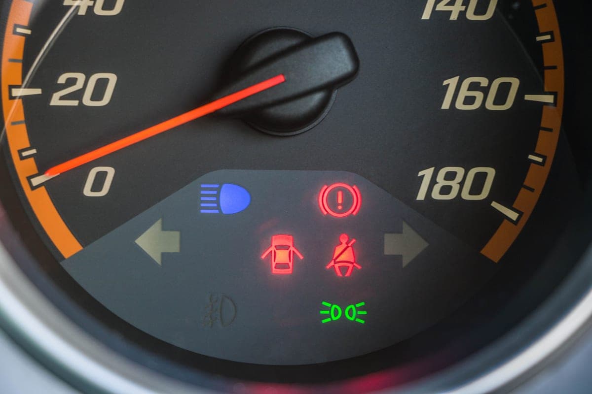 A vehicle instrument cluster illuminated at night