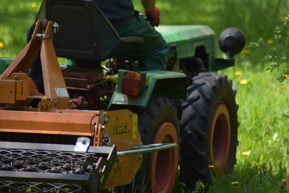 A machine being driven across open grassland
