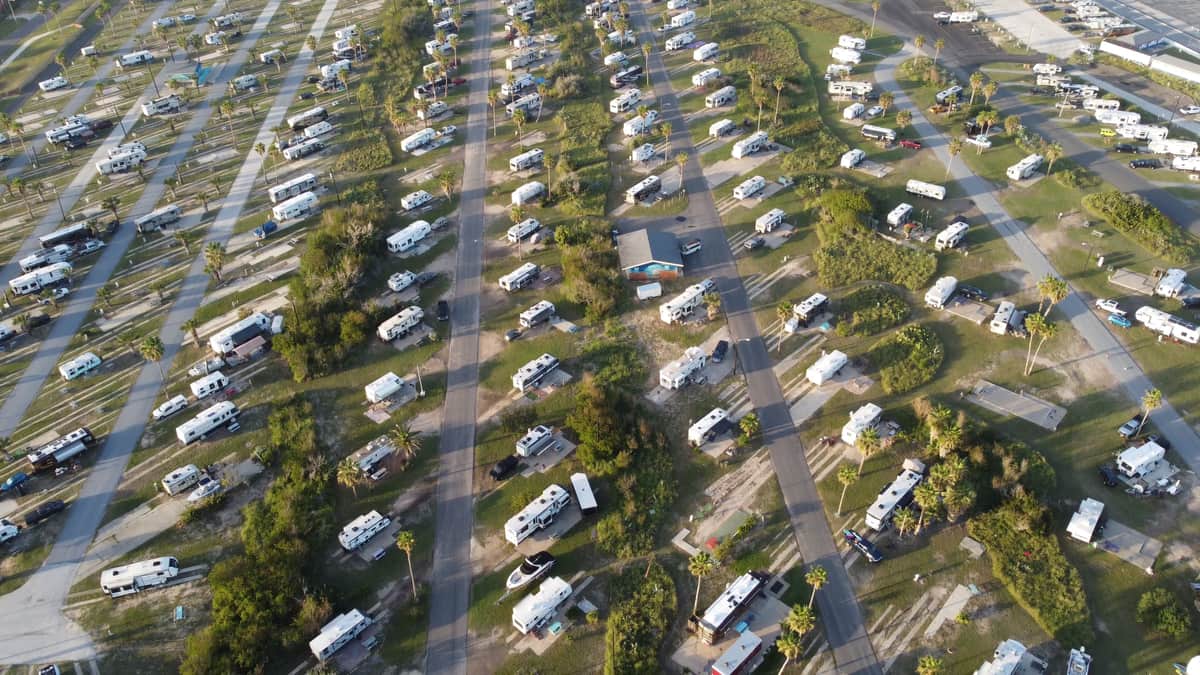 Camper vans parked in a campground