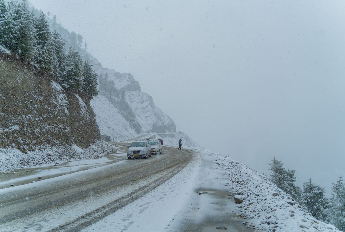 Cars on a snowy mountain road